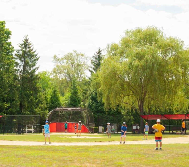 Campers playing baseball.