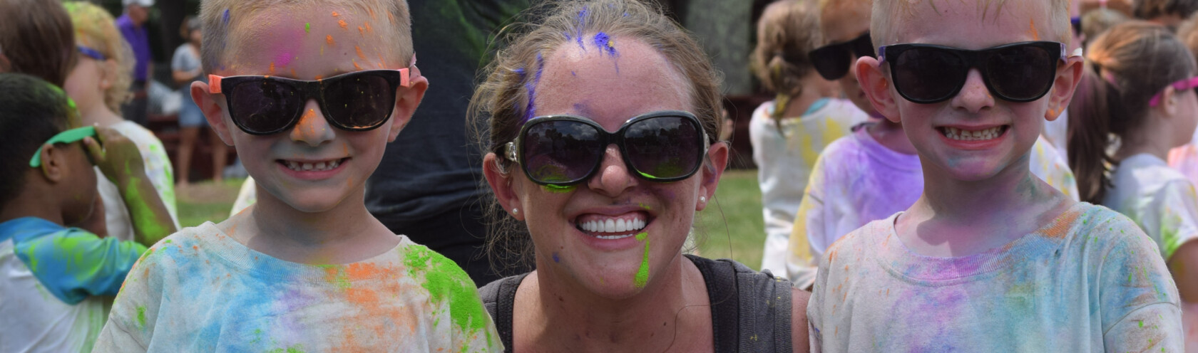 A Summer Trails staff member with two campers.